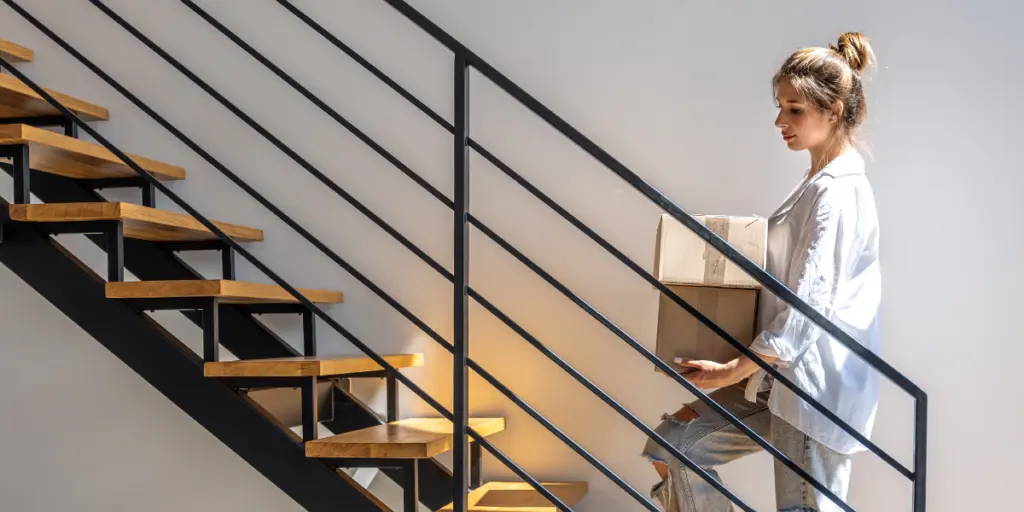 woman with iron railing stairs